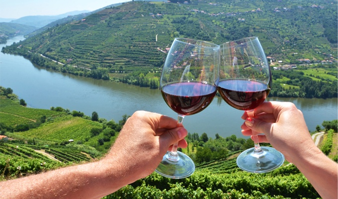 Transfer to Douro Valley and private wine estate experience with gourmet lunch, featured in the Iberia Privada Exclusive Grand Tour by Lux Motion.