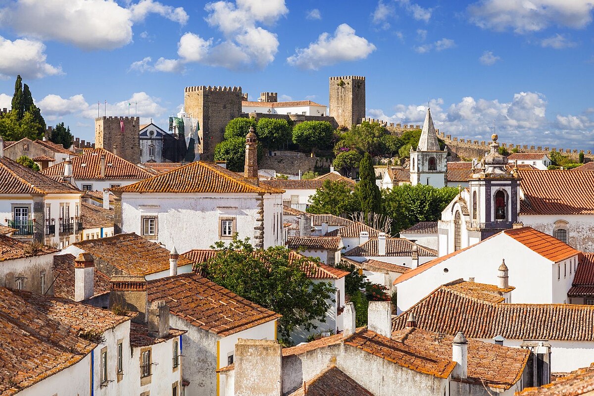Óbidos medieval village and castle, one of the Seven Wonders of Portugal and home to the famous Ginja liqueur, featured in the Fátima, Batalha, Nazaré & Óbidos Private Day Tour by Lux Motion.