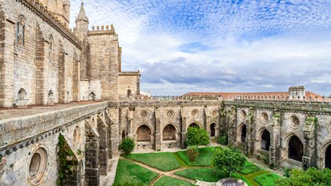 Évora Cathedral, a stunning Gothic monument with asymmetrical towers and rooftop views, featured in the Lisbon to Évora Private Wine & Culture Tour by Lux Motion.